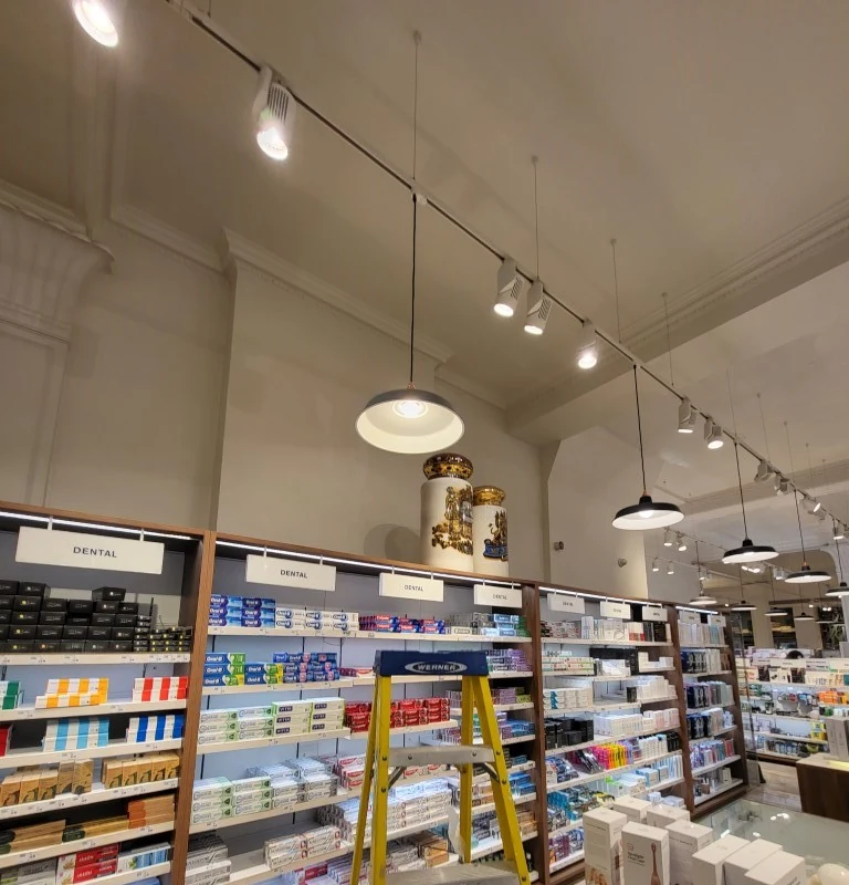 Pendant and track lighting installation in retail premises
